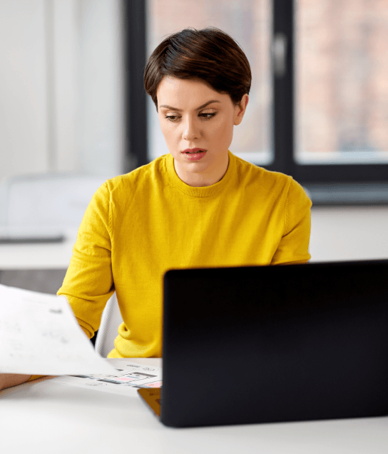 Client benefiting from certified translation services in Virginia as expert translator prepares certified legal document.